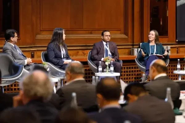 Elin Beate Saltkjel is speaking on stage during a panel debate  at a conference.